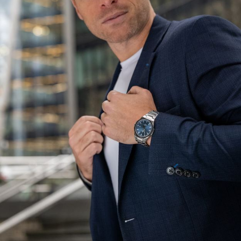 Blue evaporator dial watch with suit