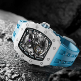 Luxury watch with blue and white strap on a dark textured surface